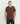 Close-up of model wearing the waffle texture on the Cappuccino Brown t-shirt, a pure cotton men's tee.