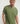 A close-up shot of a model wearing shot of the waffle texture on the Oil Green t-shirt, a men's cotton tee.