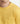 Close-up of a model wearing the Ariiston Classic Luxe T-shirt in Rattan Yellow, showcasing its premium fabric and stylish design.
