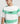 Model close-up in the Ariiston Brush Stroke Drop Shoulder in White and Green Colour