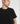 Close-up of Ariiston acid emboss graphic t-shirt in black worn by model