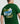 Close-up of the back graphic on the eden green 'Adventure' t-shirt worn by a model