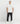 Man wearing marshmallow white Ariiston 'Loop' men’s graphic t-shirt, standing full body view.