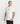 Close-up of a model showing the fit of the marshmallow white 'Loop' t-shirt