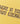 Close-up of the 'Energy' graphic on the rattan yellow Ariiston t-shirt