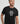 Close-up shot of a model in the black Ariiston Signature T-Shirt